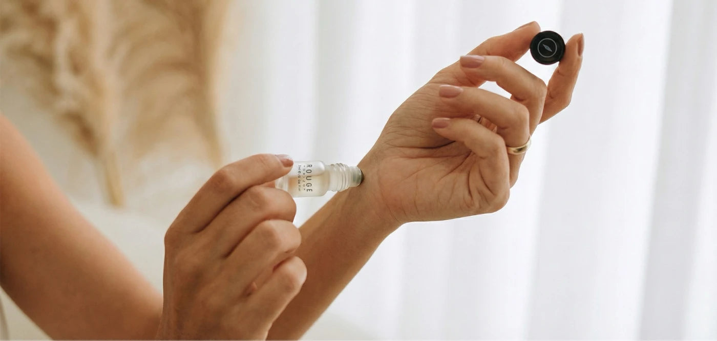 Voyara roll-on being applied to a wrist